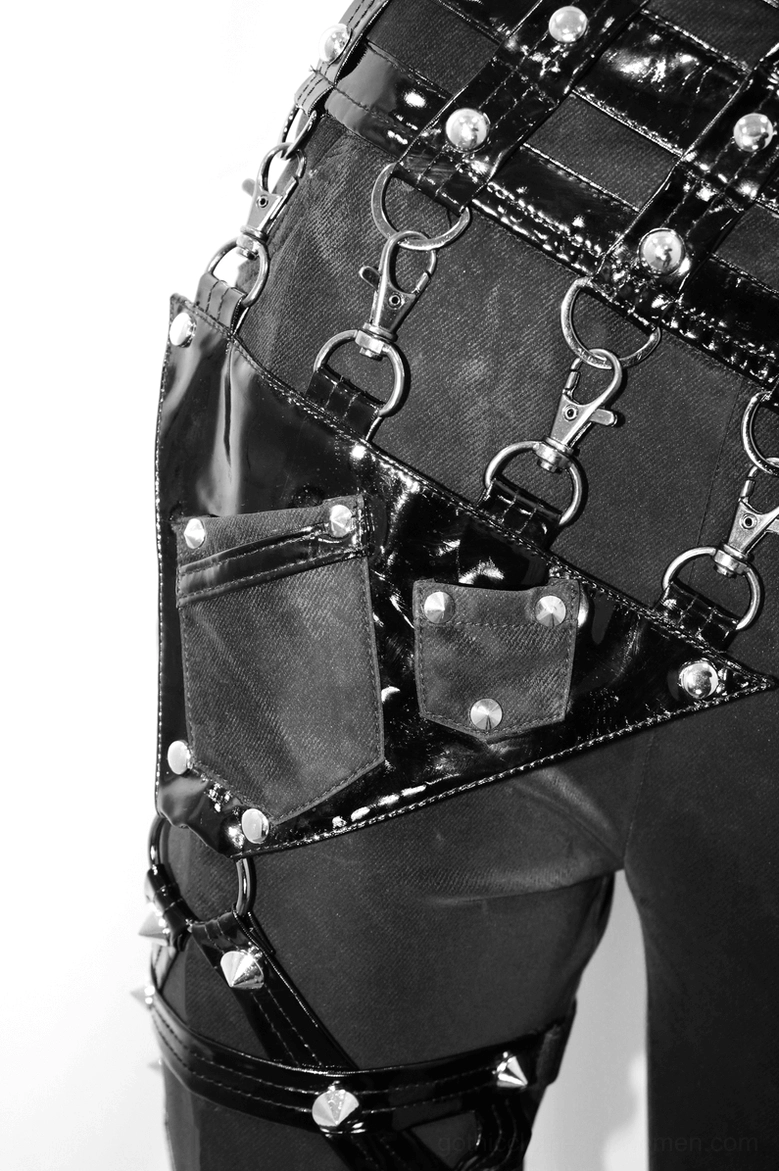 Thigh strap and pentagram buckle detail of black gothic pants with metal rivets