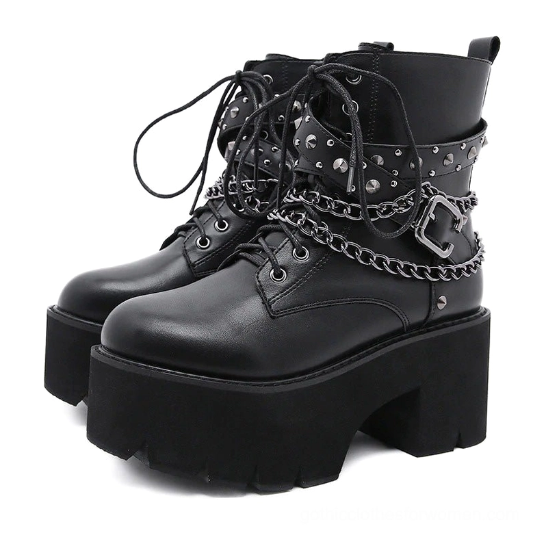Black gothic platform ankle boots with chain lace-up front and stud decorations, paired display on white background