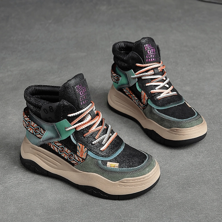 Black gothic platform patchwork boots front display, showing turquoise ethnic embroidery, thick platform sole, and lace-up construction