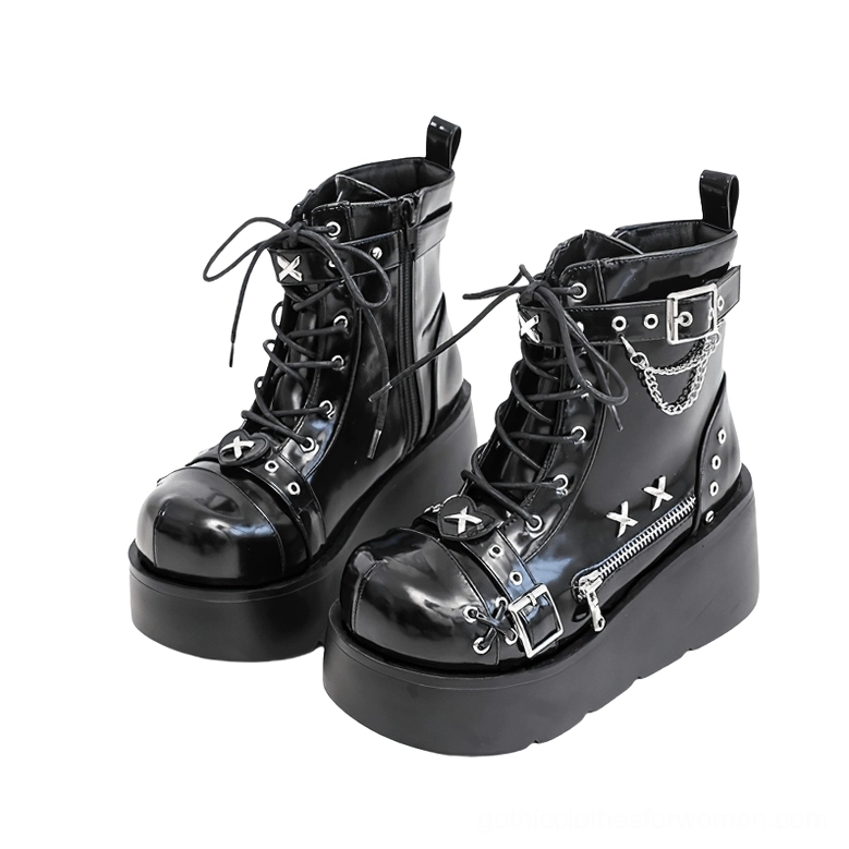 Women's black gothic platform ankle boots with cross rivet decorations and side zipper - front three-quarter view