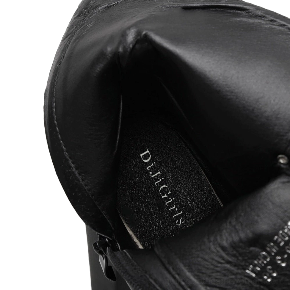 Black gothic platform boot interior close-up displaying branded insole and soft leather lining