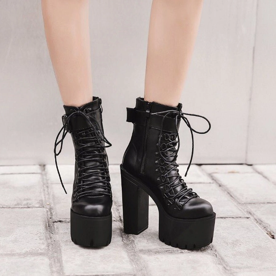 Black gothic platform boots alternate lifestyle styling showing chunky heel and all-black aesthetic on model