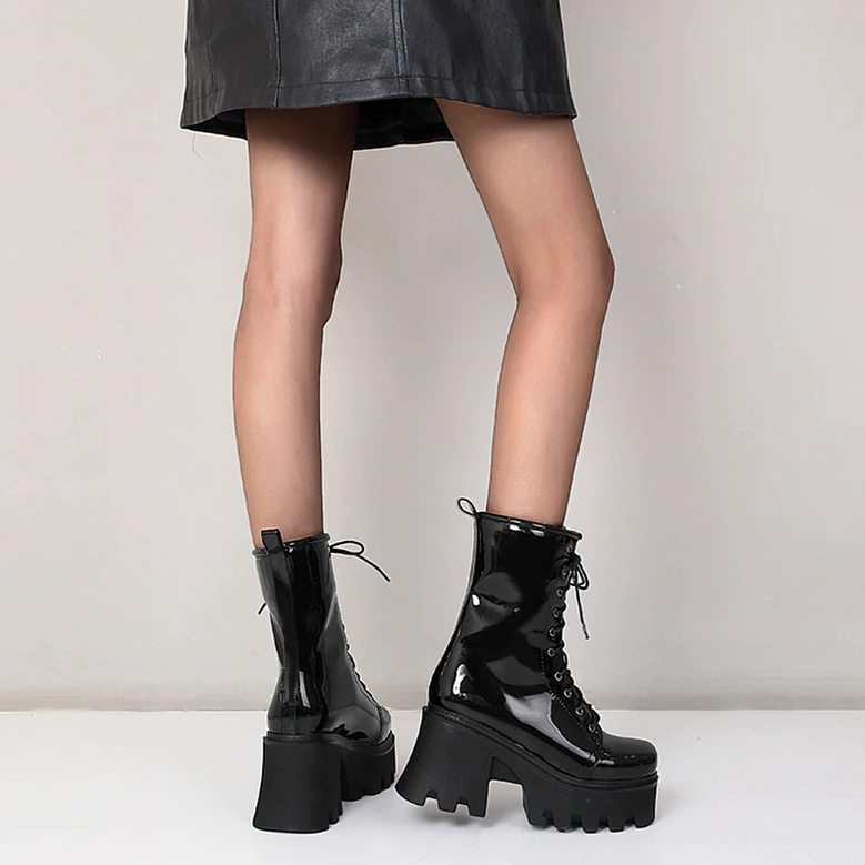 Black Patent Leather Gothic Platform Boots - Three-Quarter Angle Showcasing Chunky Platform and Heel Height