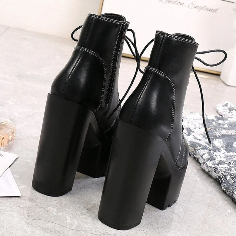 Black gothic platform boots rear oblique view showing lace-up closure and chunky square heel