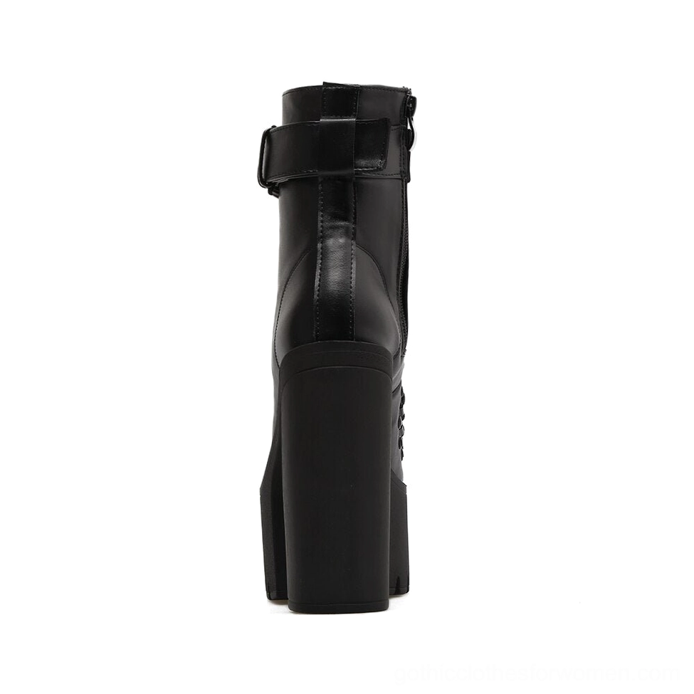Black platform ankle boot rear three-quarter view showing rear zipper closure and ankle strap buckle