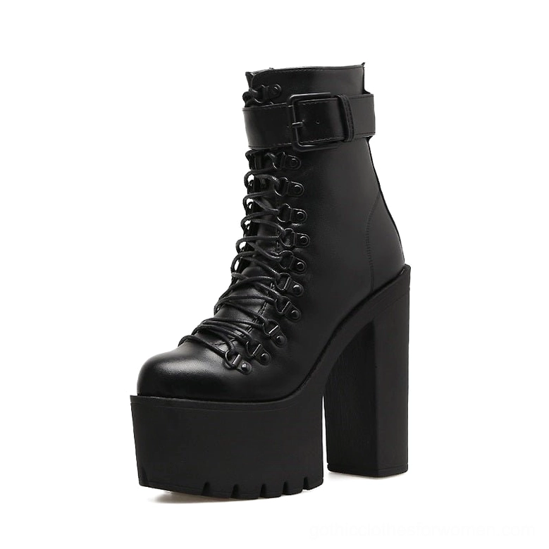Single black platform heel boot right side-front angle displaying ankle buckle strap and polished leather surface