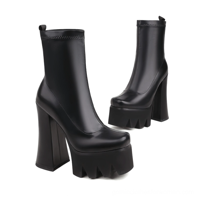Black genuine leather gothic platform boots angled side view showcasing block heel architecture and sole detailing