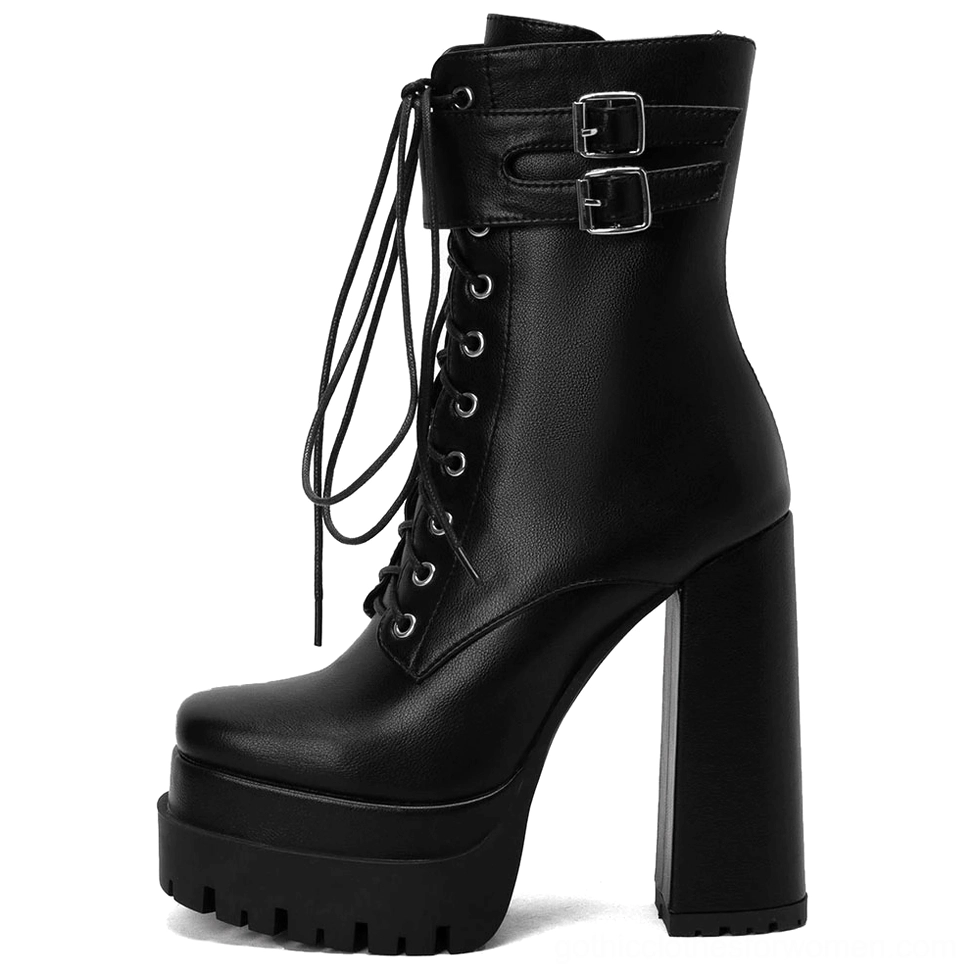 Black gothic platform ankle boots side profile showing chunky block heel and architectural design