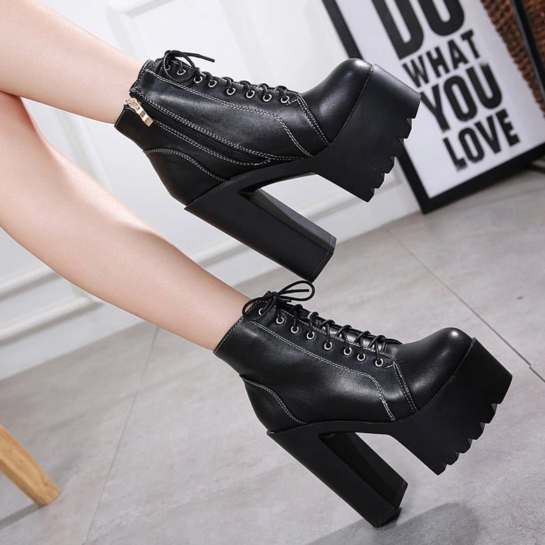 Black gothic platform ankle boots detailed view of square heel architecture and sole construction