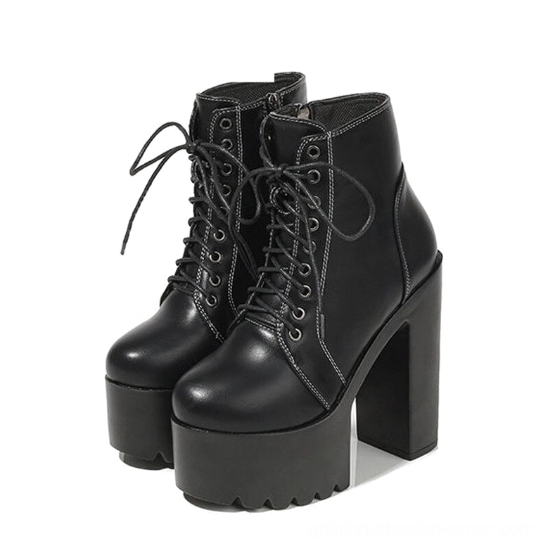 Black gothic platform ankle boots with chunky square heel and lace-up closure, front-side elevated view