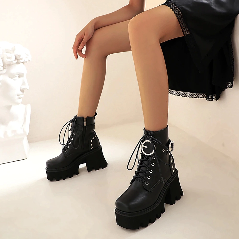 Black gothic platform combat boots close-up detail showing metal buckles, studded embellishments, and PU leather texture