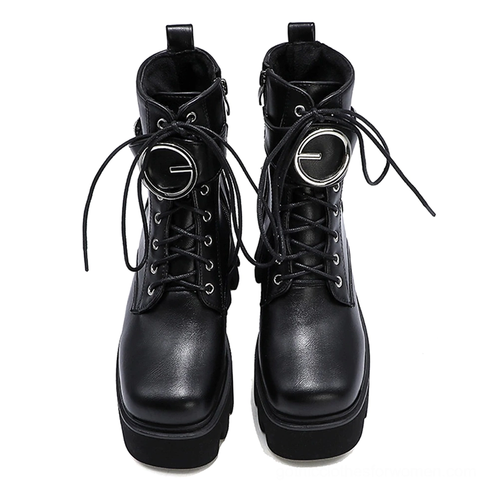 Pair of black gothic platform combat boots with lace-up buckle design and square toe silhouette, front flat lay view
