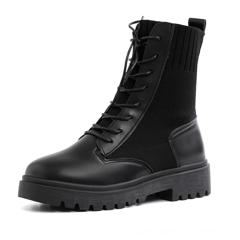 Black platform combat boots for women - gothic lace-up ankle boots with knitted collar and lug sole, side view on white background