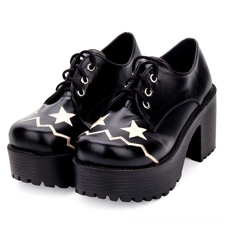 Black celestial lace-up platform oxford shoes with embroidered star details, front view showing pair