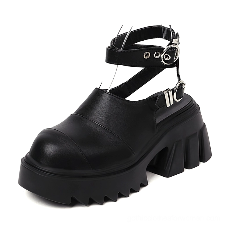 Black gothic platform sandals with adjustable metal buckle straps and chunky lug sole - front three-quarter view