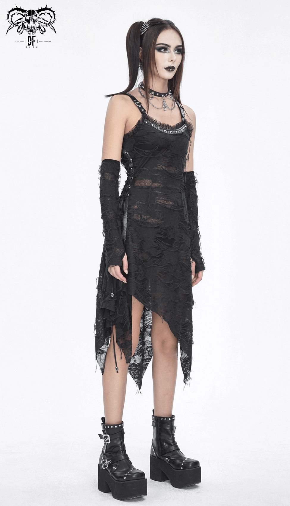 Black gothic ripped dress with long gloves showing fitted cut profile, asymmetrical hemline and torn lace details