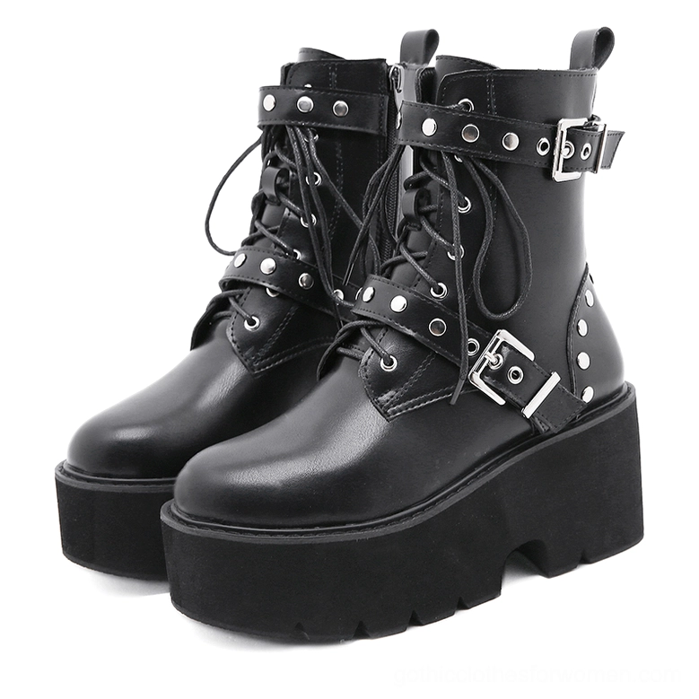Black gothic combat boots with rivets and metal buckle straps, front view on white background