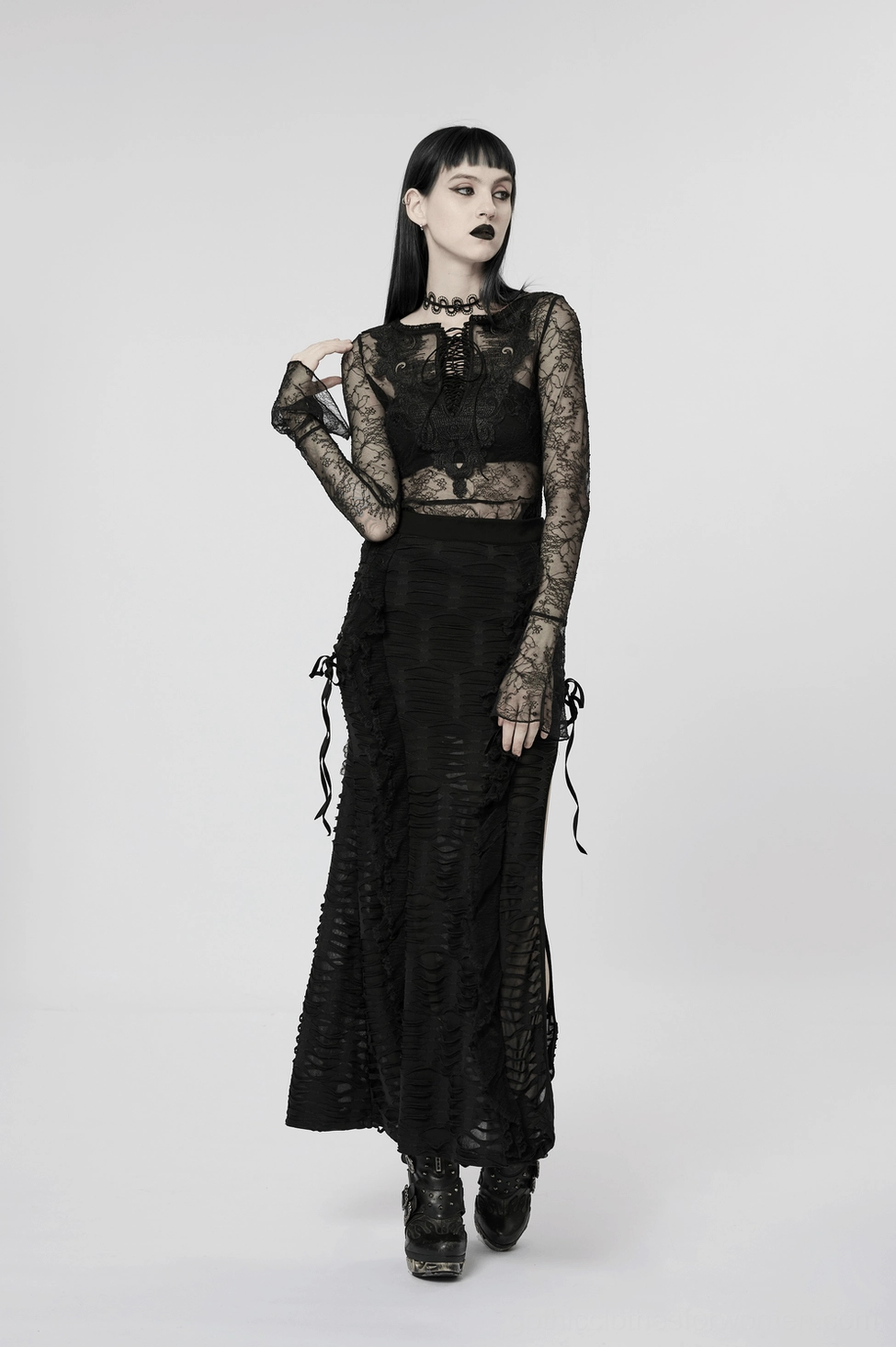 Black layered ruffle gothic maxi skirt styling detail, emphasizing the fitted waist and flowing hem silhouette