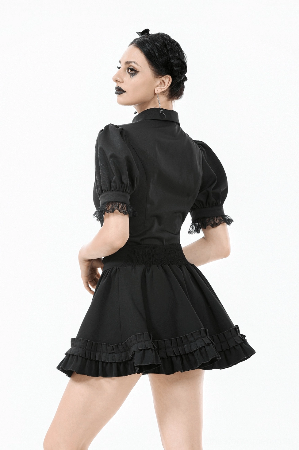 Black gothic ruffle mini skirt fabric texture and polyester sheen showing premium material quality