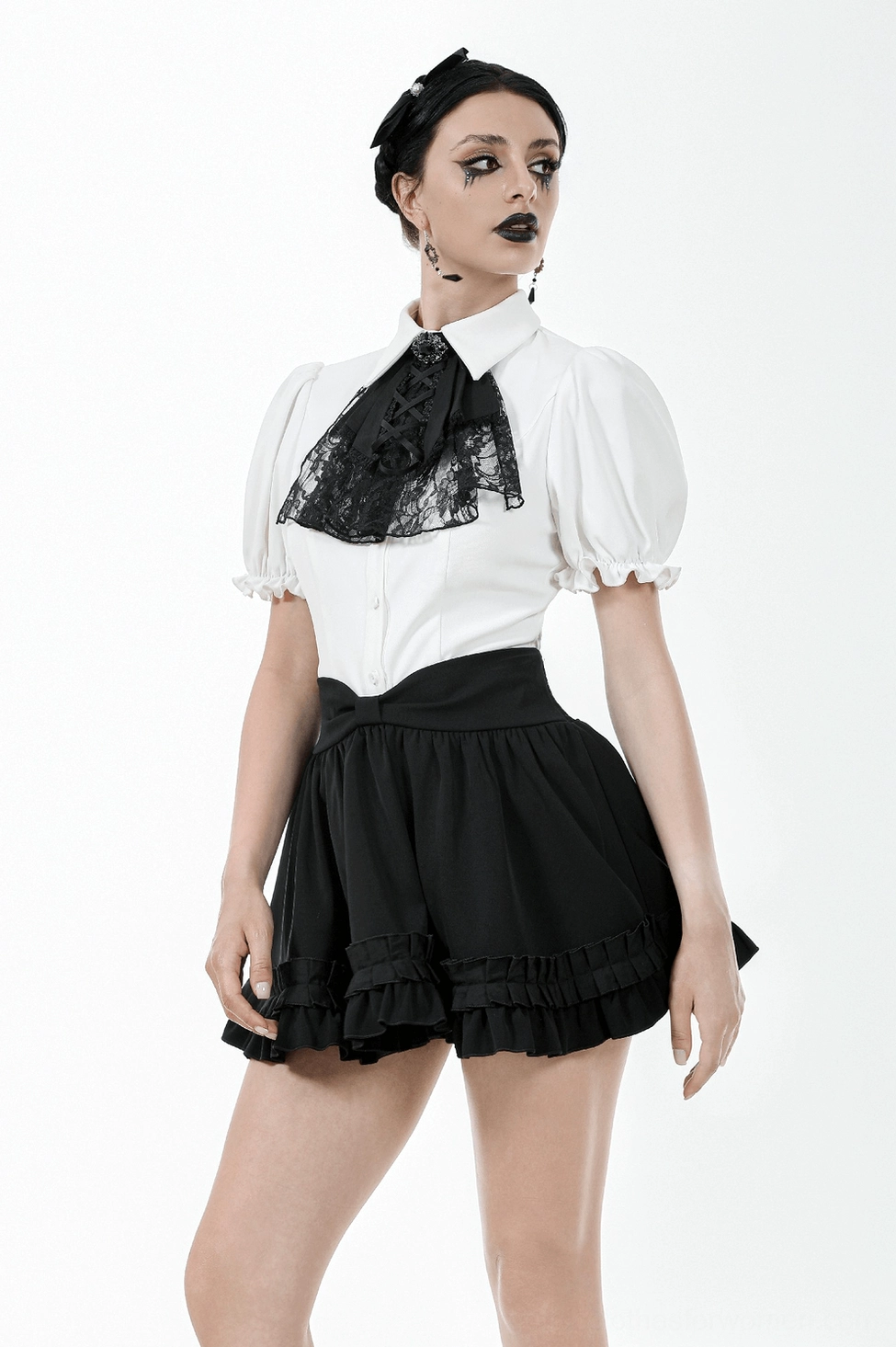 Black gothic ruffle mini skirt worn with alternative fashion ensemble showcasing versatile styling options