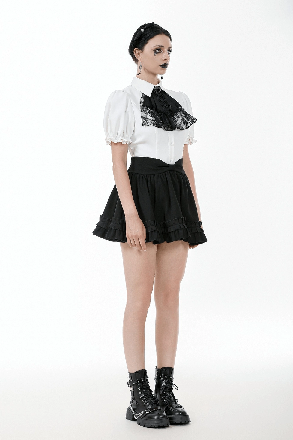 Black gothic ruffle mini skirt detail view of double ruffled hem showing texture and layering construction