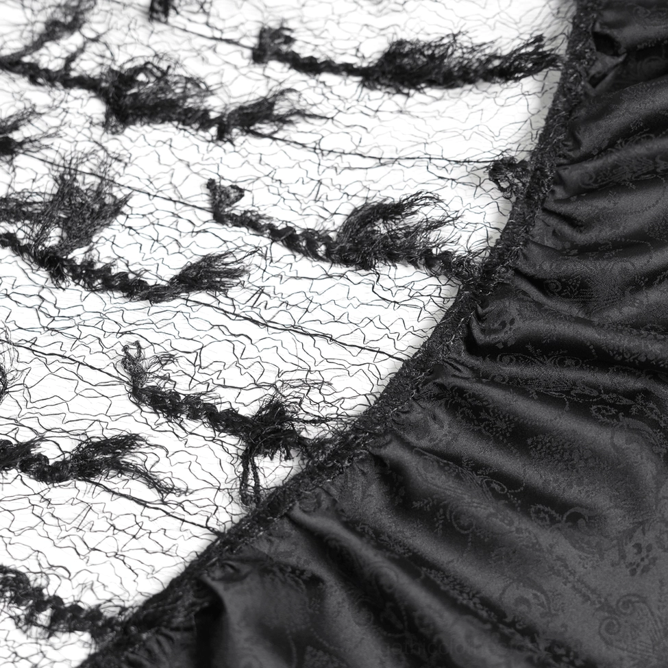 Black gothic ruffle maxi skirt showing intricate cross embellishment and fuzzy lace texture