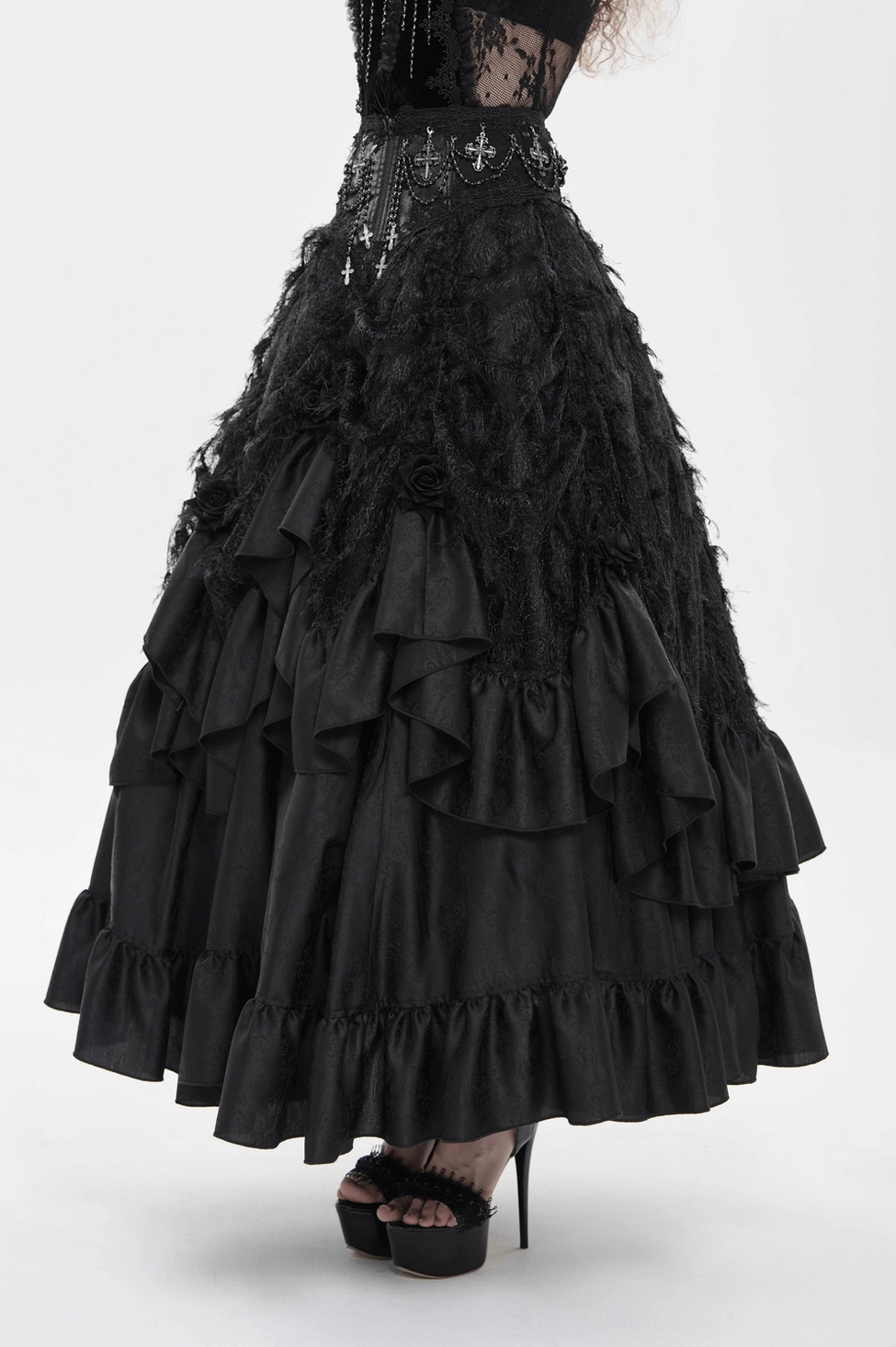Black gothic ruffle maxi skirt rear view highlighting cross charms and tiered ruffled hem