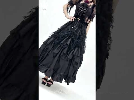 Black gothic ruffle maxi skirt side partial view showing satin ruffled hem and tiered design