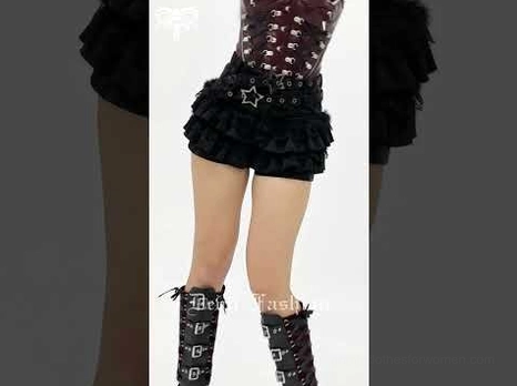 Black gothic ruffle skort styled with sheer top and tall boots, side view dark aesthetic
