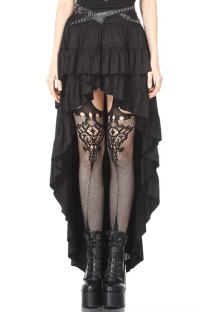 Black gothic high-low ruffled skirt with studded skull belt worn on model, featuring layered ruffle hem and silver grommets, styled with fishnet stockings and platform boots, front view