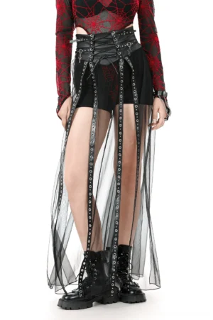 Black sheer gothic maxi skirt with studded leather corset waist, front three-quarter view on model wearing combat boots and alternative fashion styling