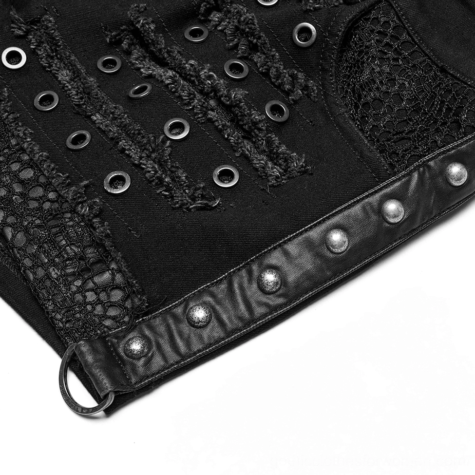 Macro detail shot of gothic shorts showing metal eyelets, distressed frayed cuts, and studded leather strap embellishments