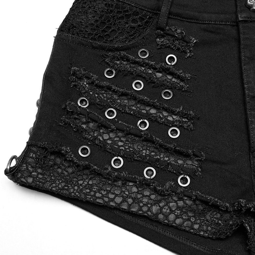 Close-up side view of gothic shorts front panel featuring metal eyelets, lace hem trim, and strategic distressed frayed details