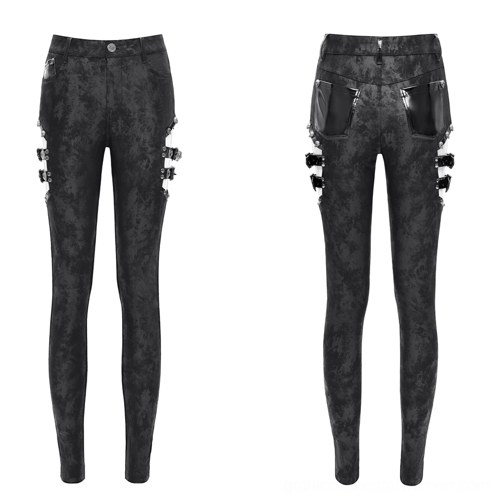 Black gothic skinny pants product display front view showing side buckle straps and high-waisted fit