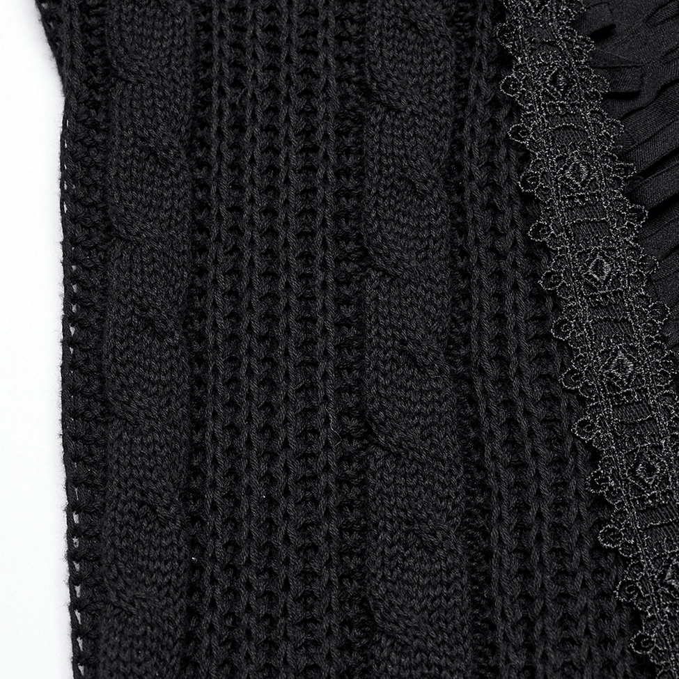 Close-up detail of black gothic skirt thick cable knit fabric with decorative lace trim