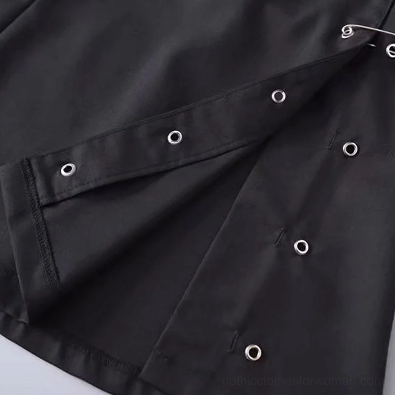 Detailed close-up of black gothic skirt front panel showing metal eyelets, wrap front fastening hardware, and premium fabric construction