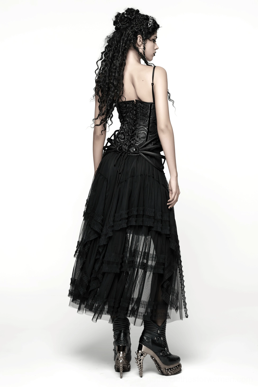 Black gothic mesh skirt texture close-up showing jacquard pattern and sheer mesh overlay combination