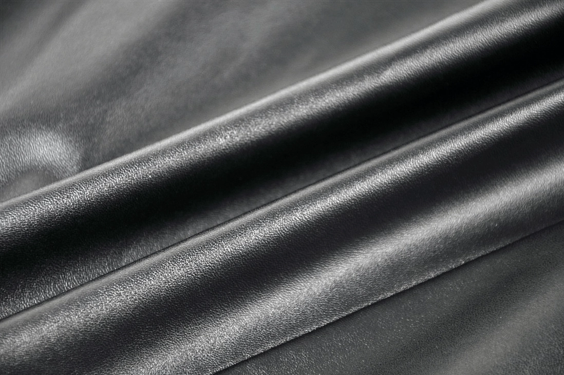 Premium faux leather seam and hardware detail on black asymmetric gothic skirt showing craftsmanship quality