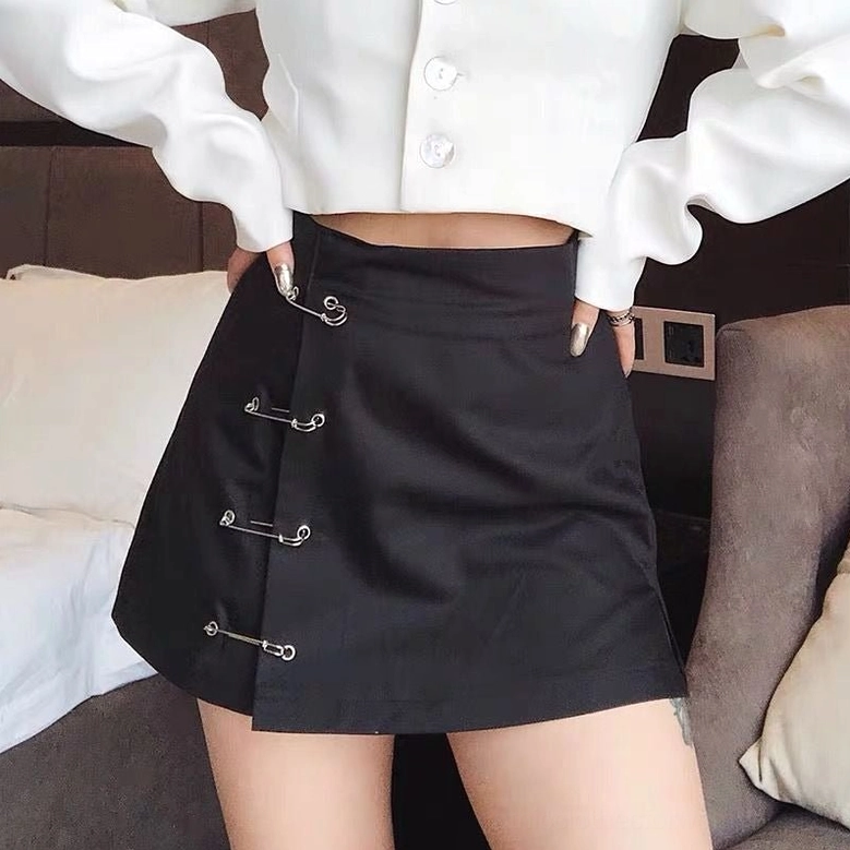 Black A-line gothic skirt safety pin side decoration detail close-up product photography