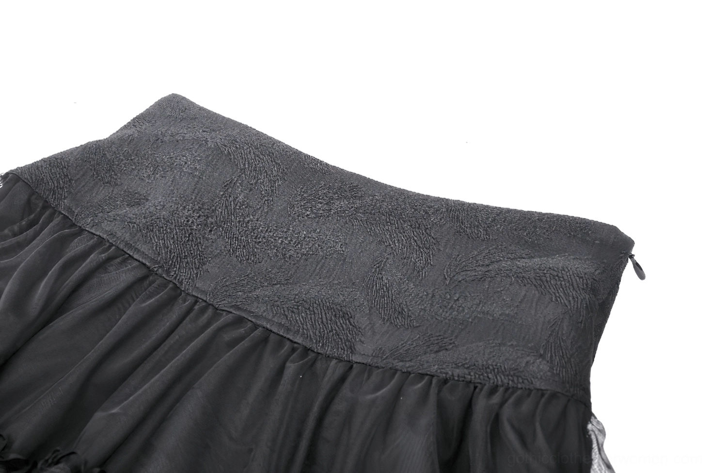 Side close-up view of black gothic mini skirt waist and tiered tulle ruffle hem detail with matte jacquard waistband