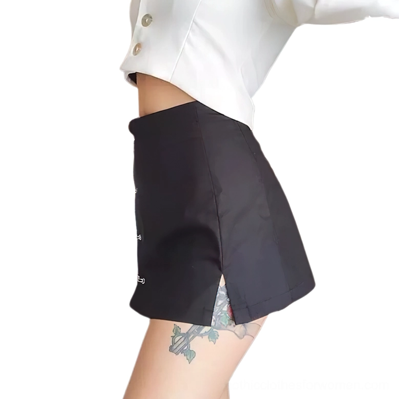 Black slit A-line gothic skirt side view with safety pin details, partial model close-up