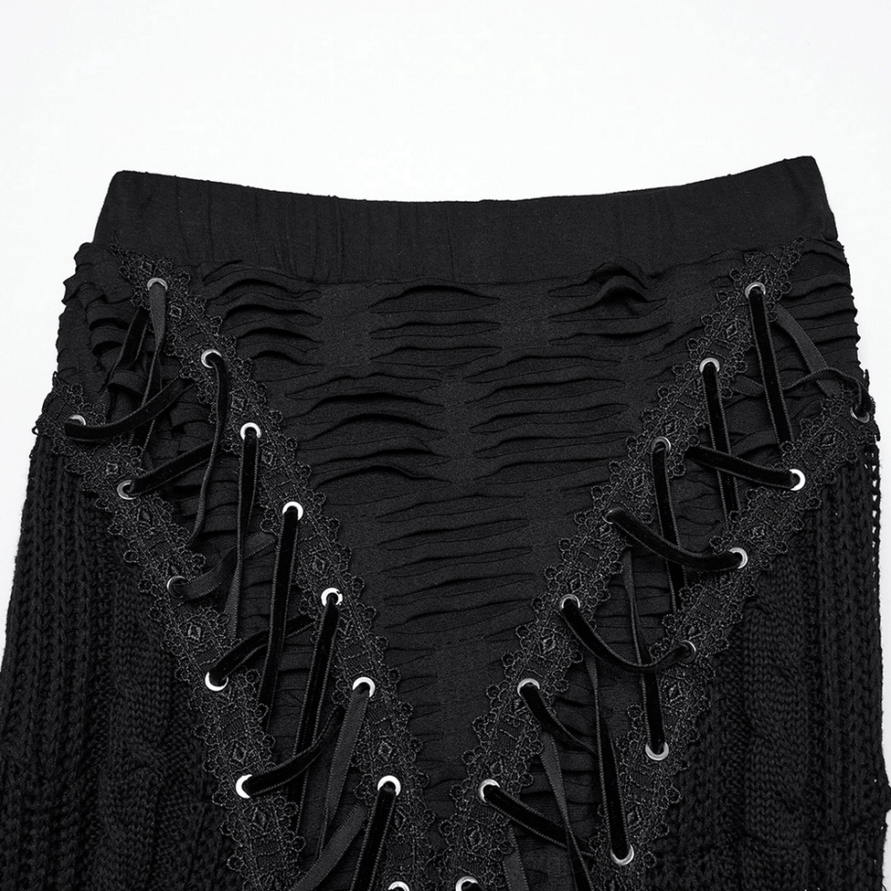 Close-up detail of black gothic skirt waist and metal eyelet lace-up panel with elastic waistband