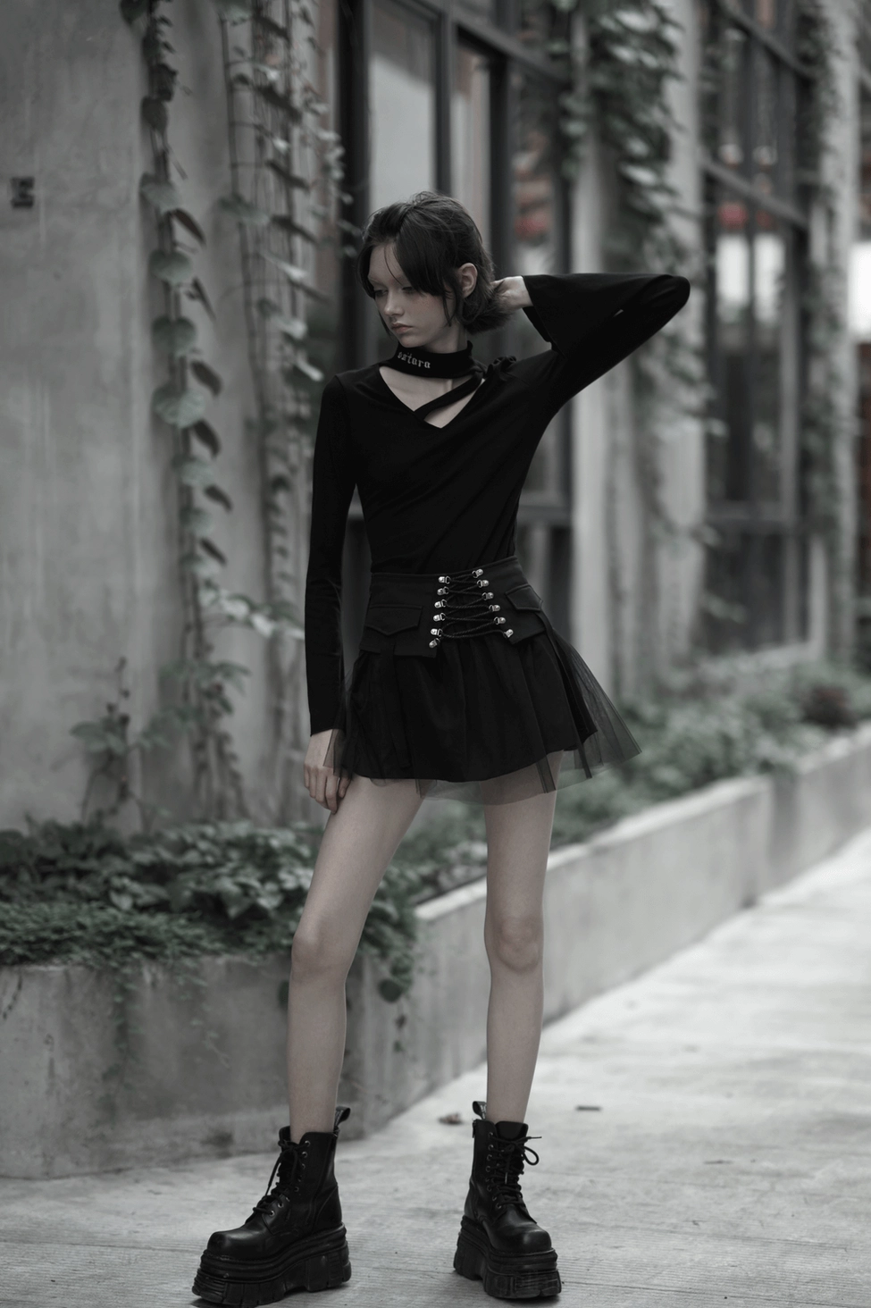 High-waist black gothic mini skirt construction detail showing inelastic waistband and inner chiffon lining