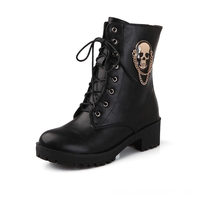 Black gothic ankle boots with metal skull and gold chain ornament, displayed on white background showcasing lace-up combat styling and platform sole
