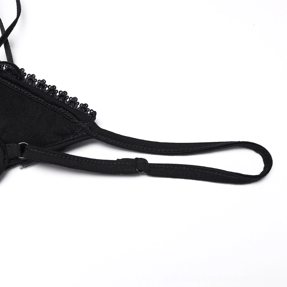 Close-up of beaded lace edge and adjustable spaghetti strap on black gothic slip dress