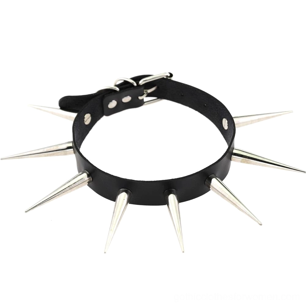 Black faux leather gothic choker necklace with sharp metal spikes arranged flat lay on white background, front view detail