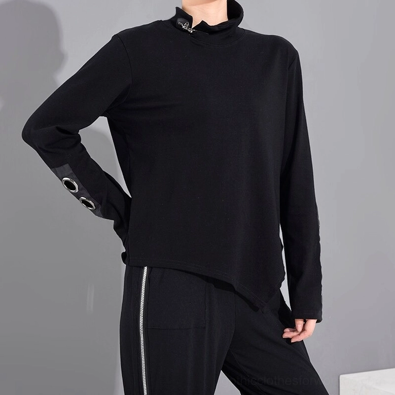Women's black gothic top with stand collar zipper and metal grommet sleeve cuffs, three-quarter right model view
