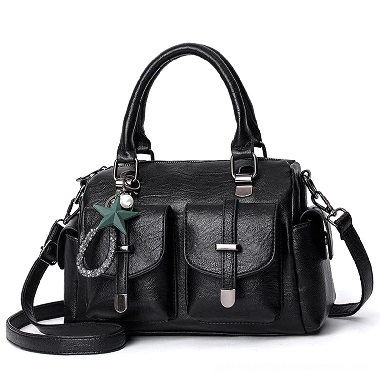 Black gothic star pendant leather handbag with dual front pockets, detachable strap, and celestial charm - front view