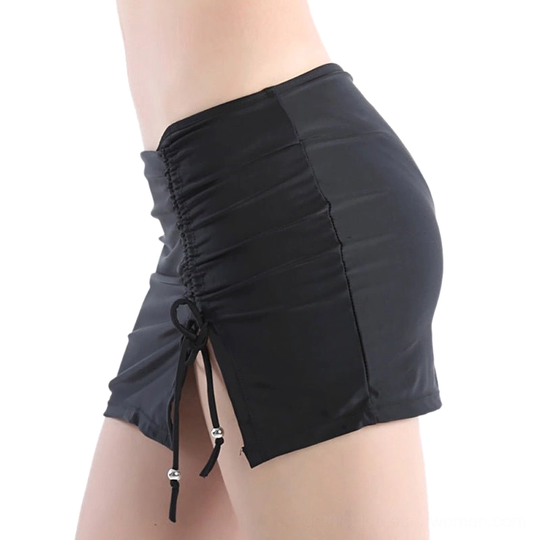 Black gothic swim skirt rear three-quarter view showing side drawstring and ruched side panel construction
