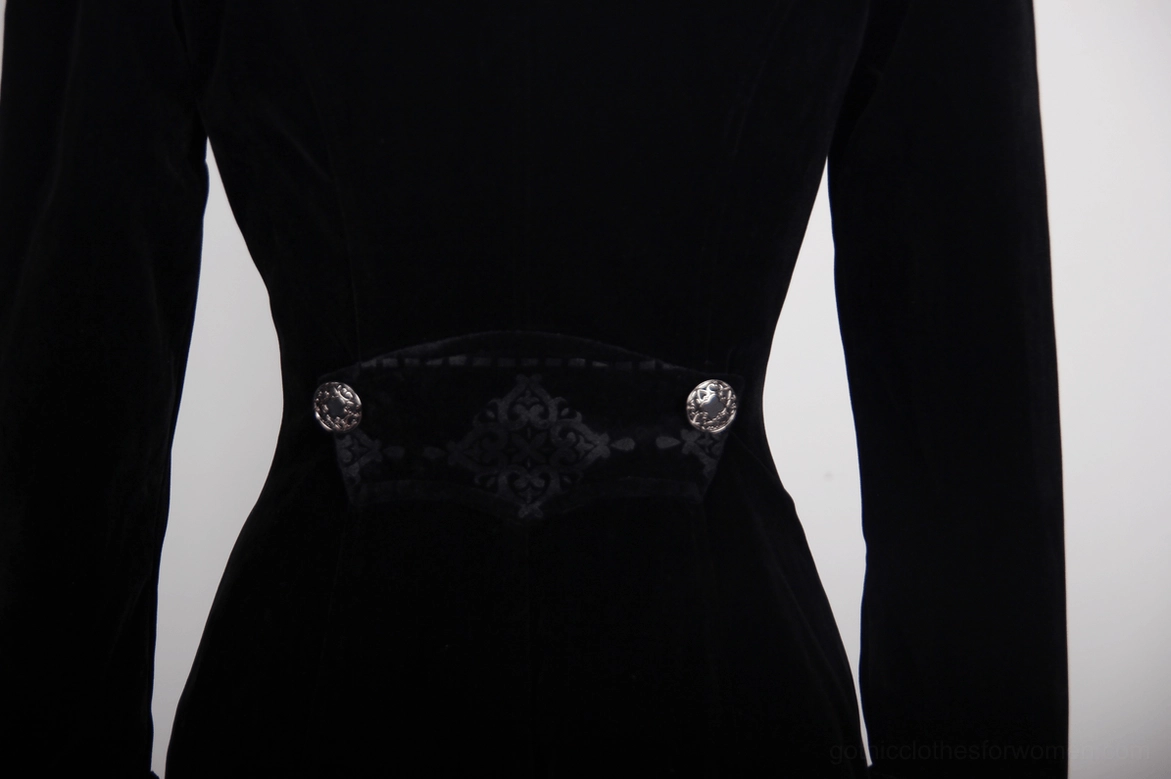 Black gothic velvet tailcoat front facing and construction detail showing craftsmanship and embellishment work